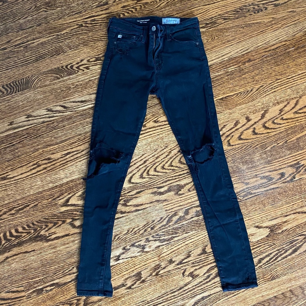 Black skinny jeans with rips in knees